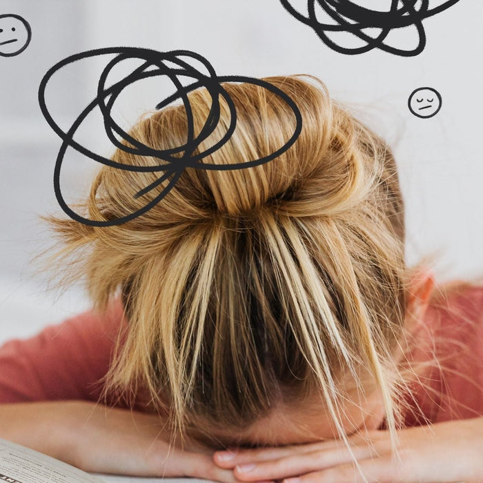 A young girl frustrated with schoolwork, showing how ADHD and weak working memory cause "brain fog" and forgetfulness.