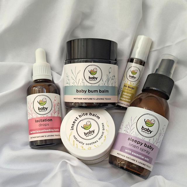 Babynature baby health remedies and essentials lying on a white blanket