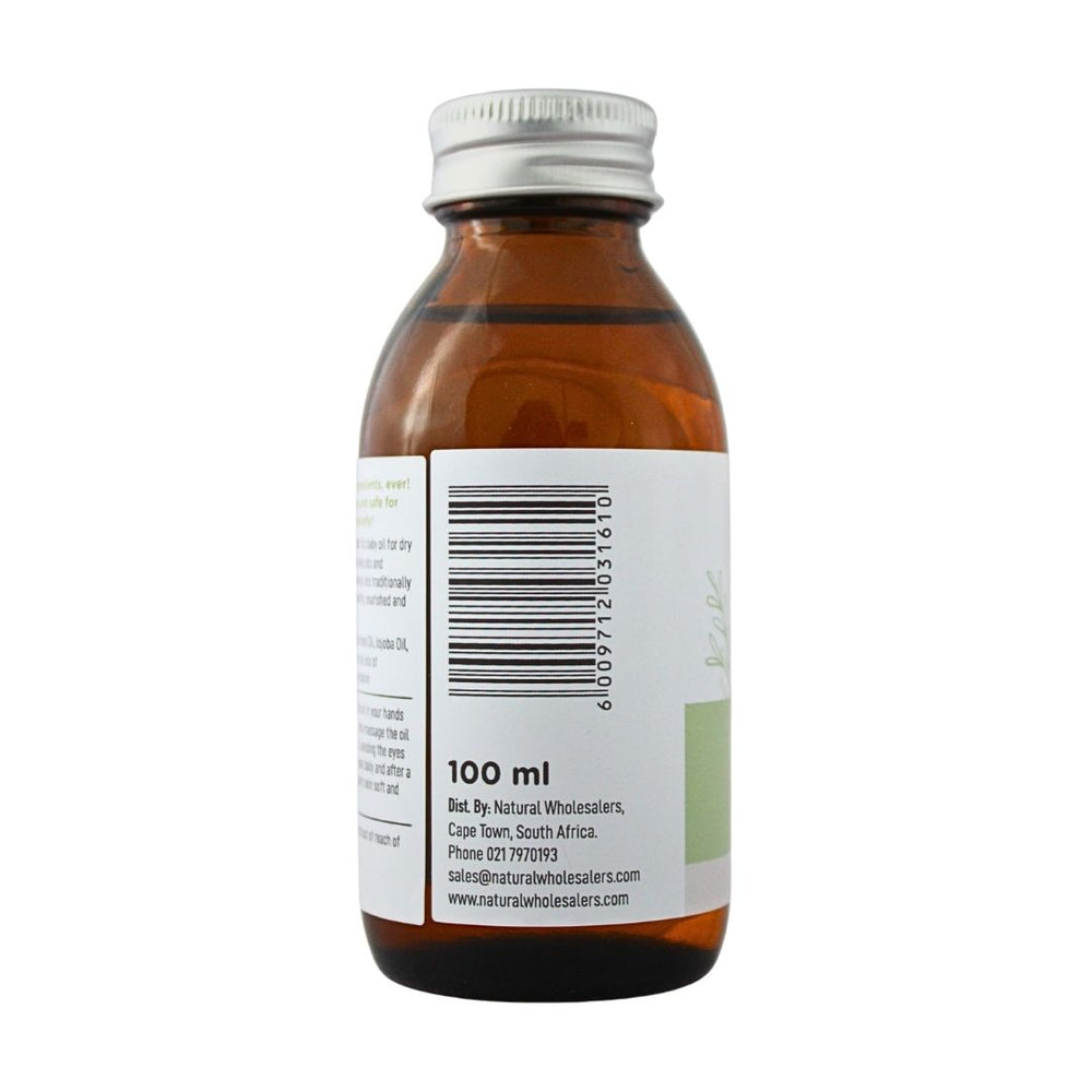 Baby Nature Dry Skin Massage Oil bottle showing the barcode, 100 ml size, and distributor details.