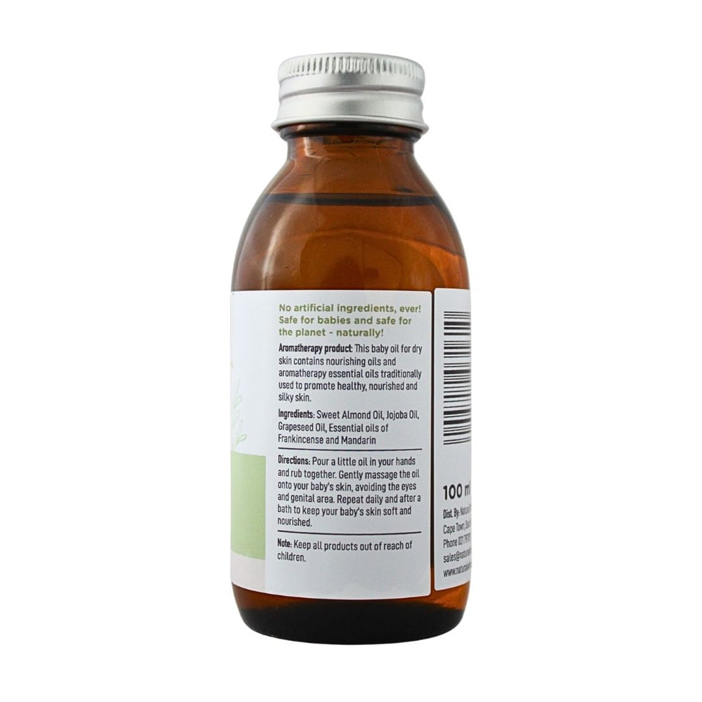 Baby Nature Dry Skin Massage Oil bottle showing product information, ingredients, directions, and safety instructions.
