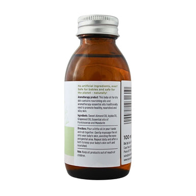Baby Nature Dry Skin Massage Oil bottle showing product information, ingredients, directions, and safety instructions.