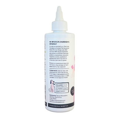 Devoted by Nature Eye Cleanser bottle showing the back label with “No Artificial Ingredients Naturally!” messaging and product care information