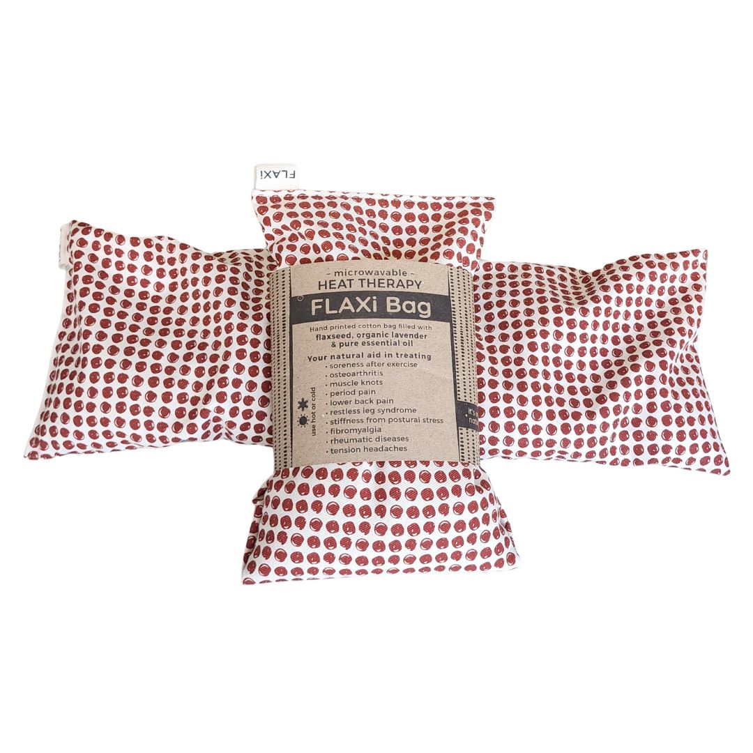 Red polka dot flaxseed natural heat therapy with a label on a white background