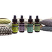 FLAXi natural refresher mists including Flu & Cold Mist, Lavender Mist, Be Calm Mist and Headache Mist displayed with FLAXi pillows.