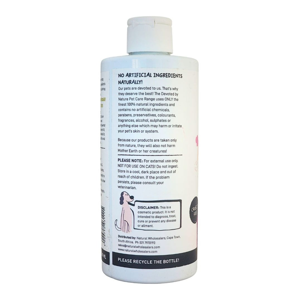 Devoted by Nature pet care bottle showing the back label with 100% natural ingredients, usage instructions, and a reminder that the product is for external use only.