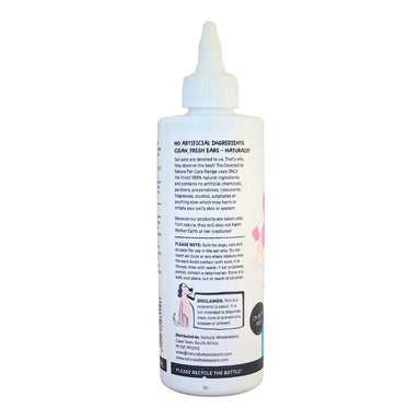 Devoted by Nature Ear Cleanser bottle showing the back label with “No Artificial Ingredients Naturally!” messaging and product care information.